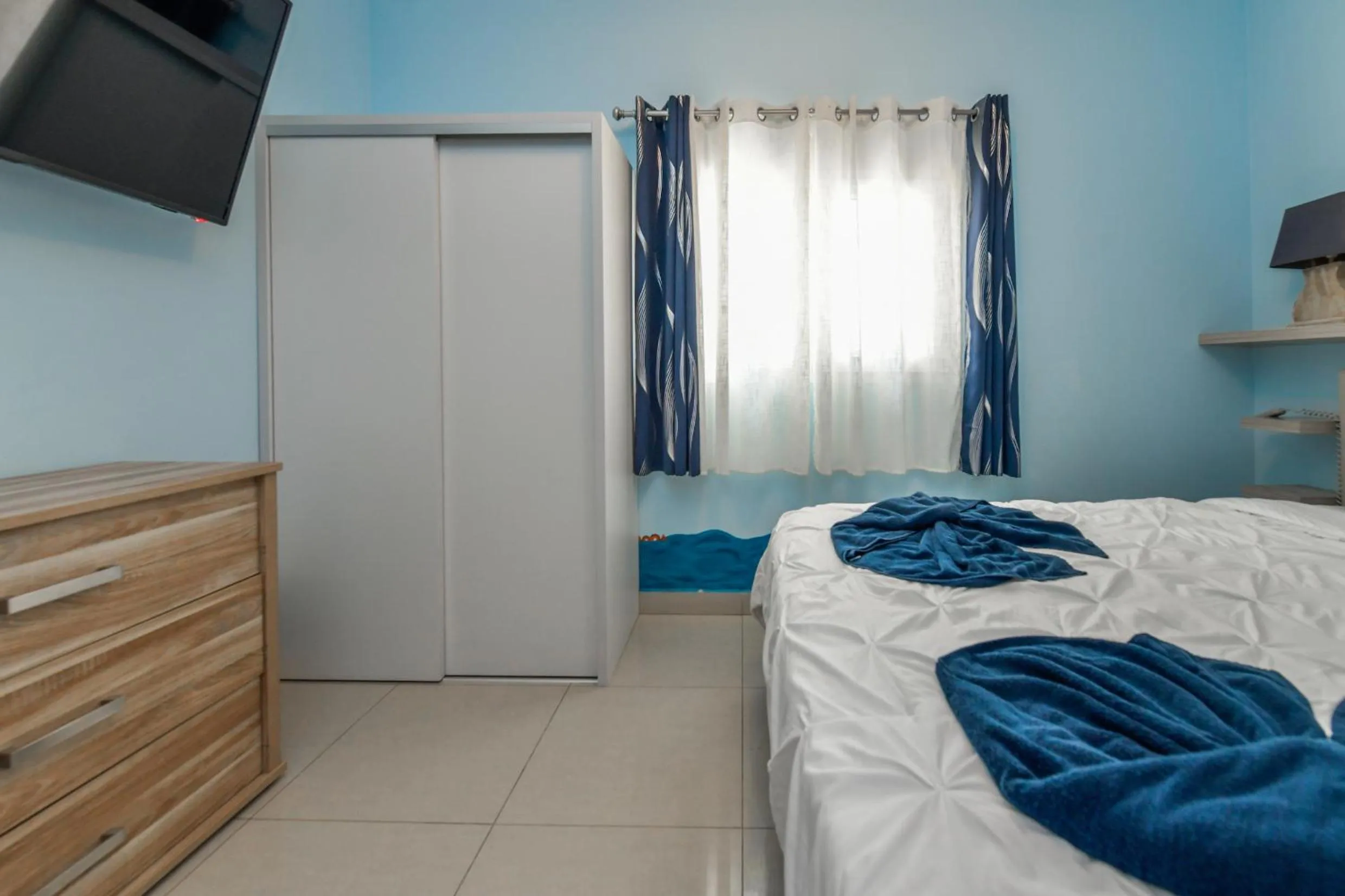 Bed in Boutique Hotel Swiss Paradise Aruba Villas and Suites