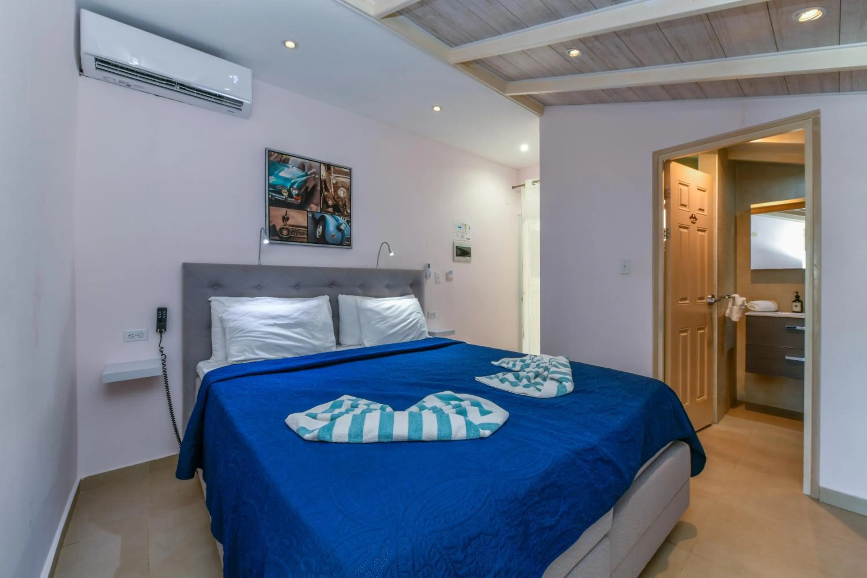 Bed in Boutique Hotel Swiss Paradise Aruba Villas and Suites