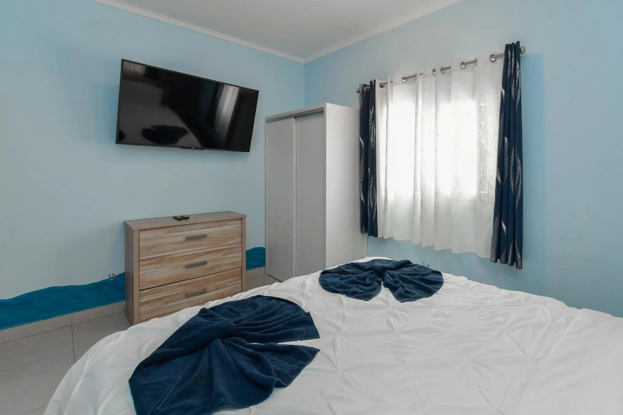 Bed in Boutique Hotel Swiss Paradise Aruba Villas and Suites