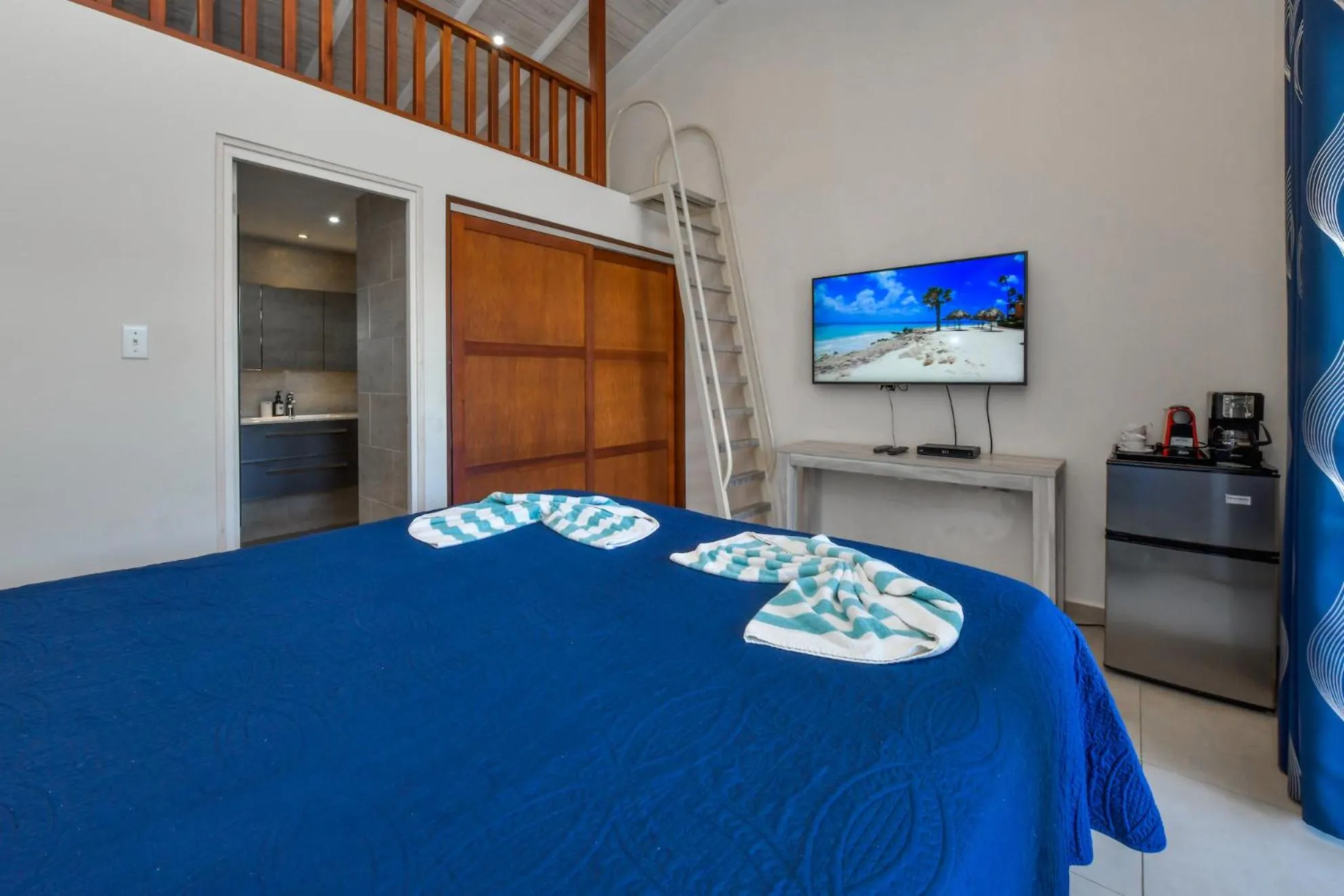 Bed in Boutique Hotel Swiss Paradise Aruba Villas and Suites