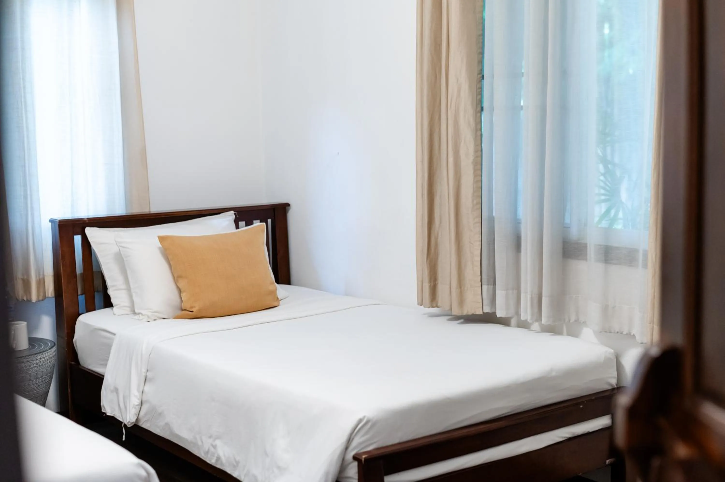 Bed in Tolani Southgate Villa Chiang Mai