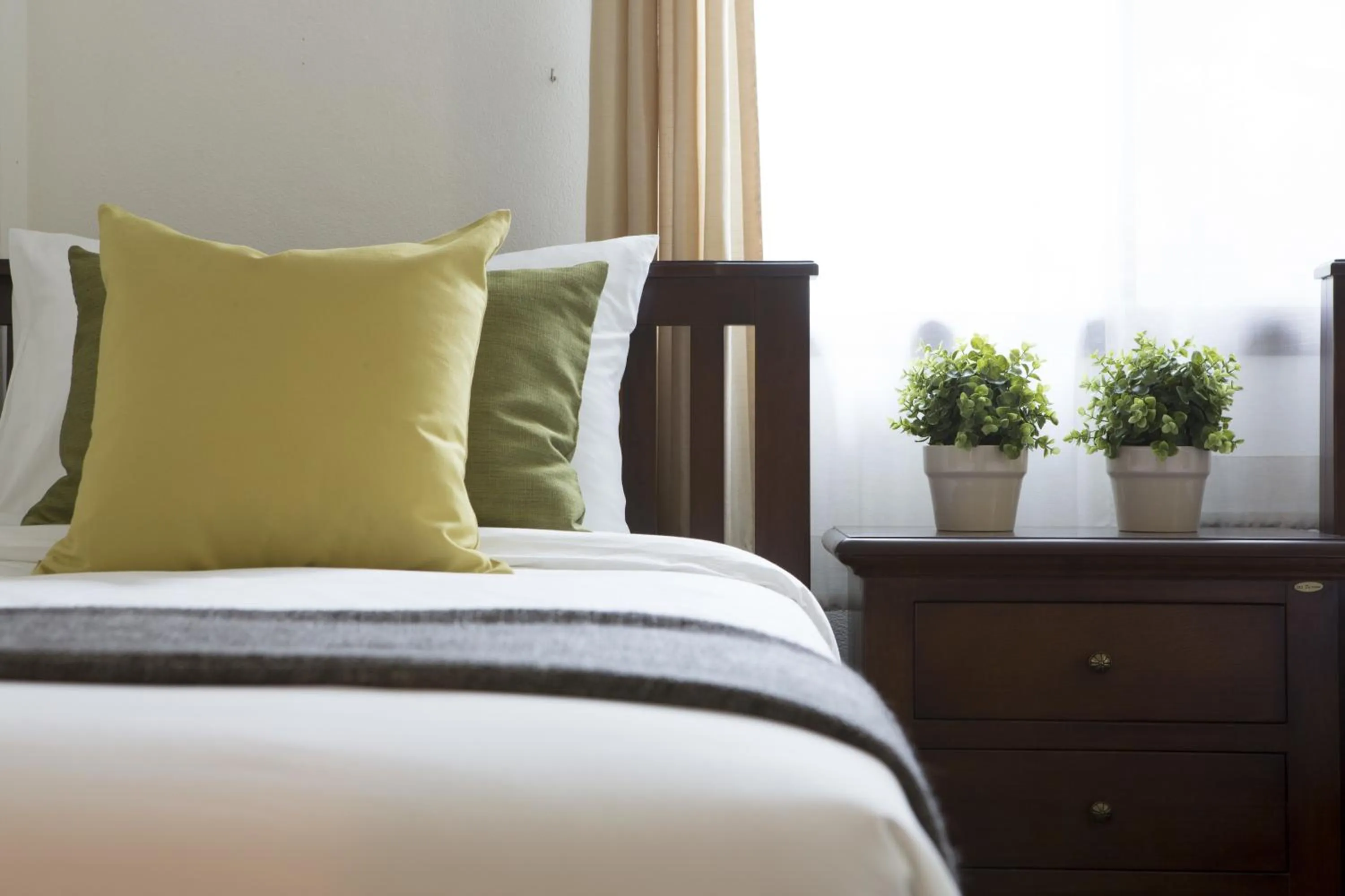 Bed in Tolani Southgate Villa Chiang Mai