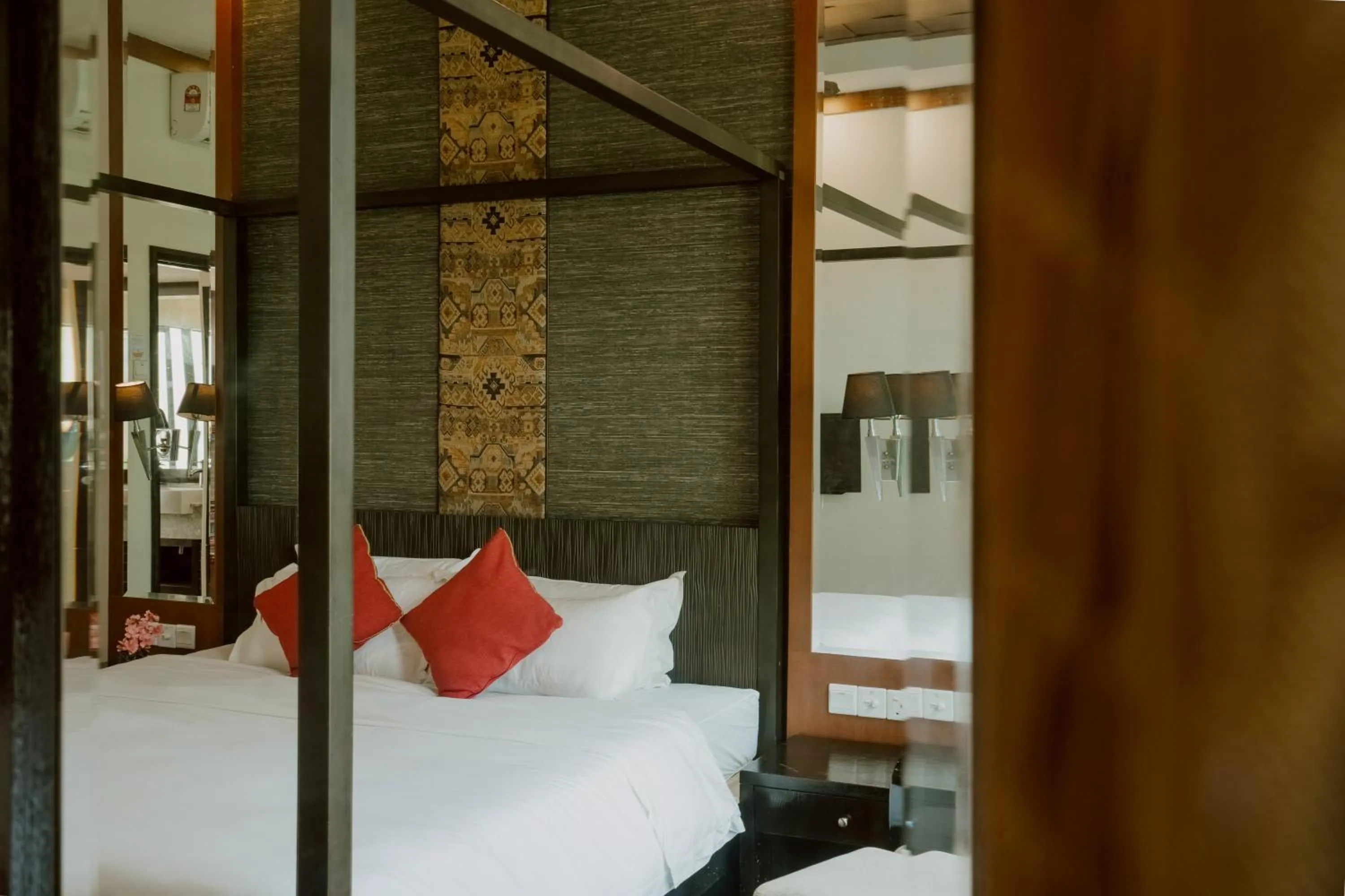 Bed in Borneo Beach Villa & Suite