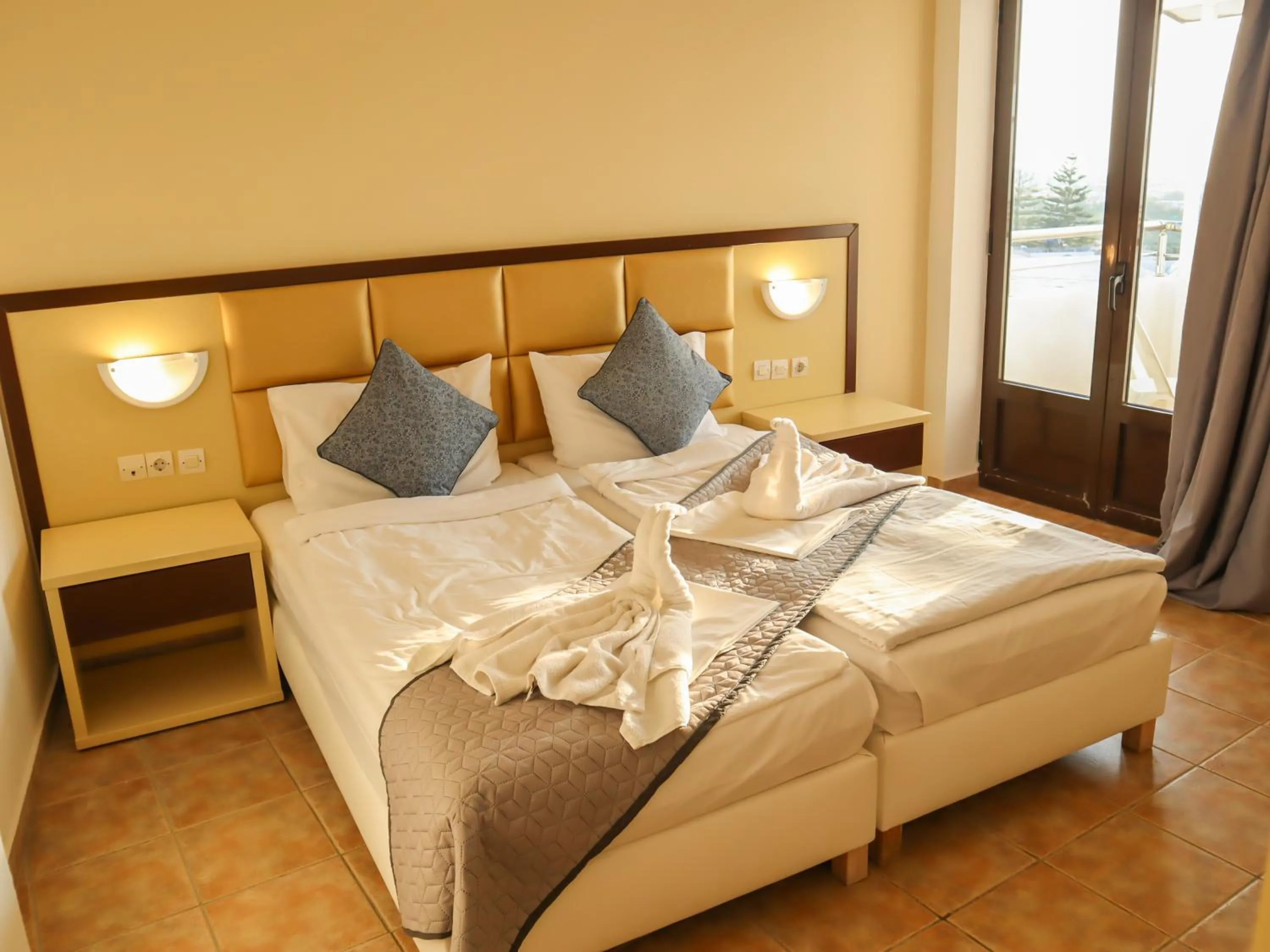 Bed in Sunset Paradise Resort