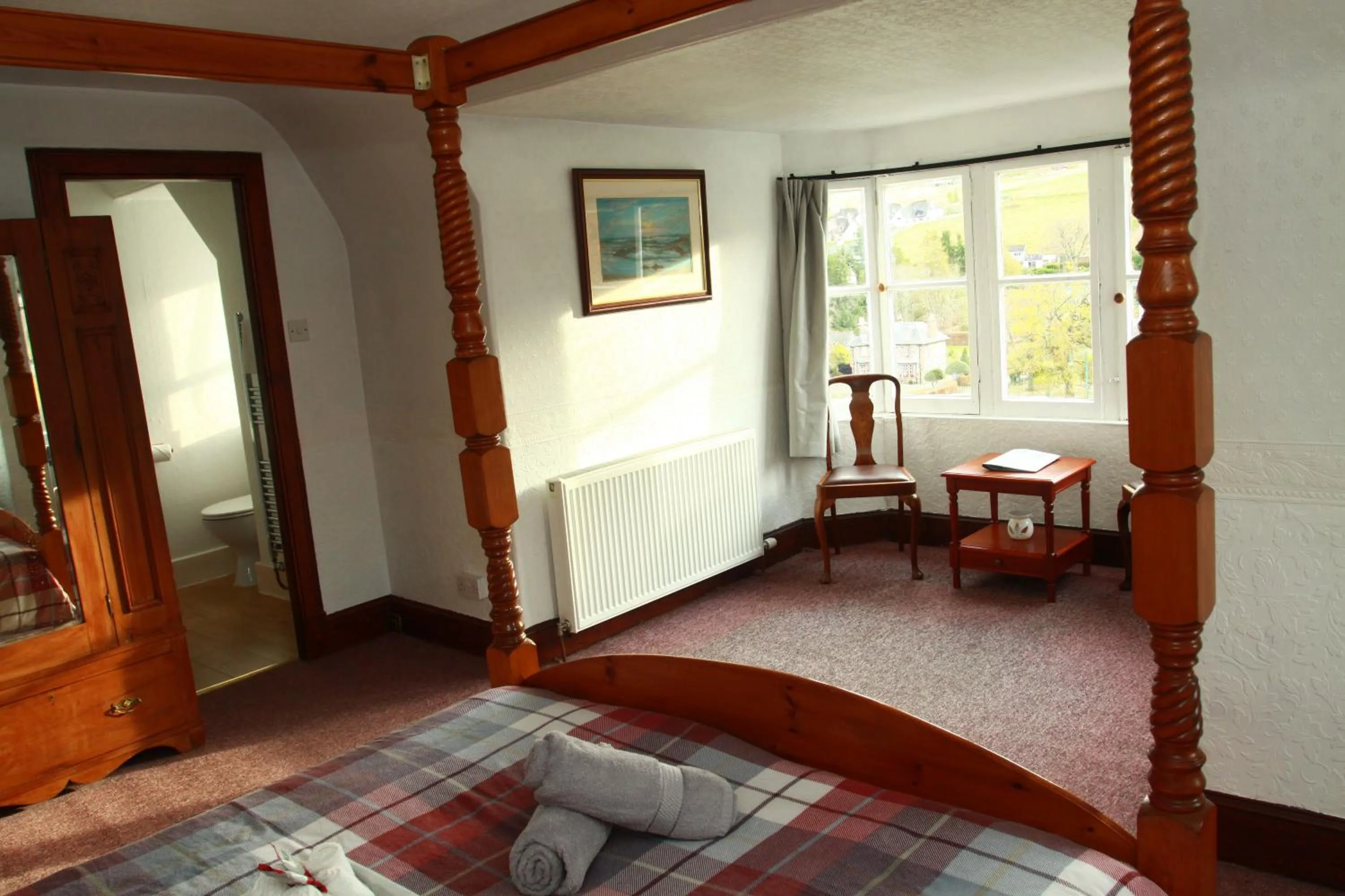 Bed in The Retreat Hotel