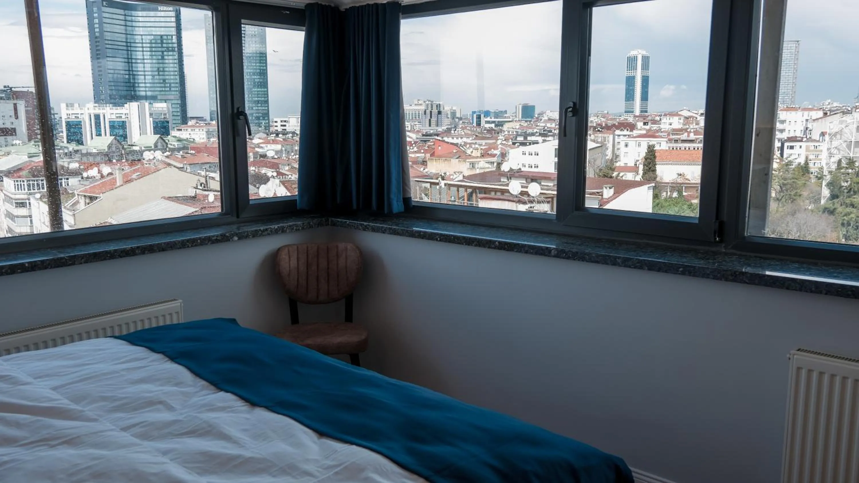 Photo of the whole room, Bed in The Blue Suites