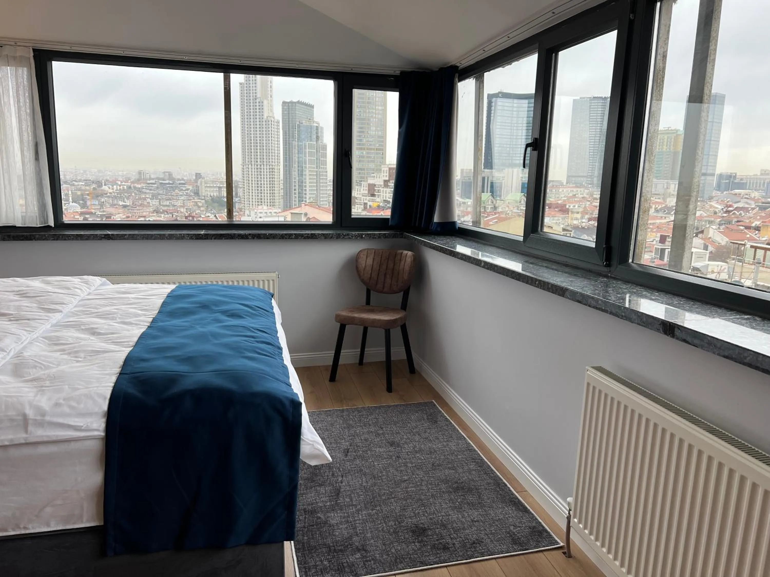 Photo of the whole room, Bed in The Blue Suites