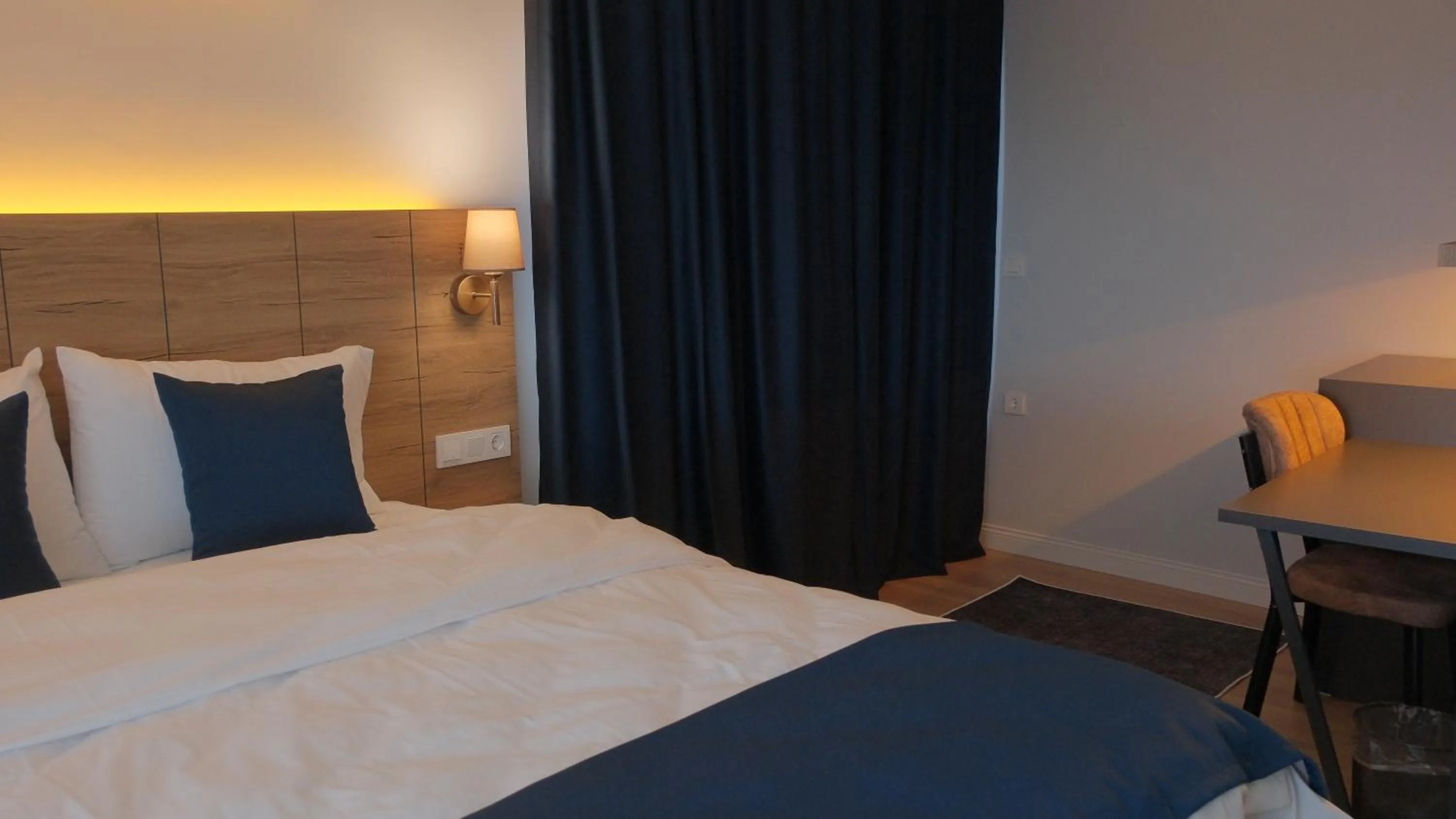 Photo of the whole room, Bed in The Blue Suites