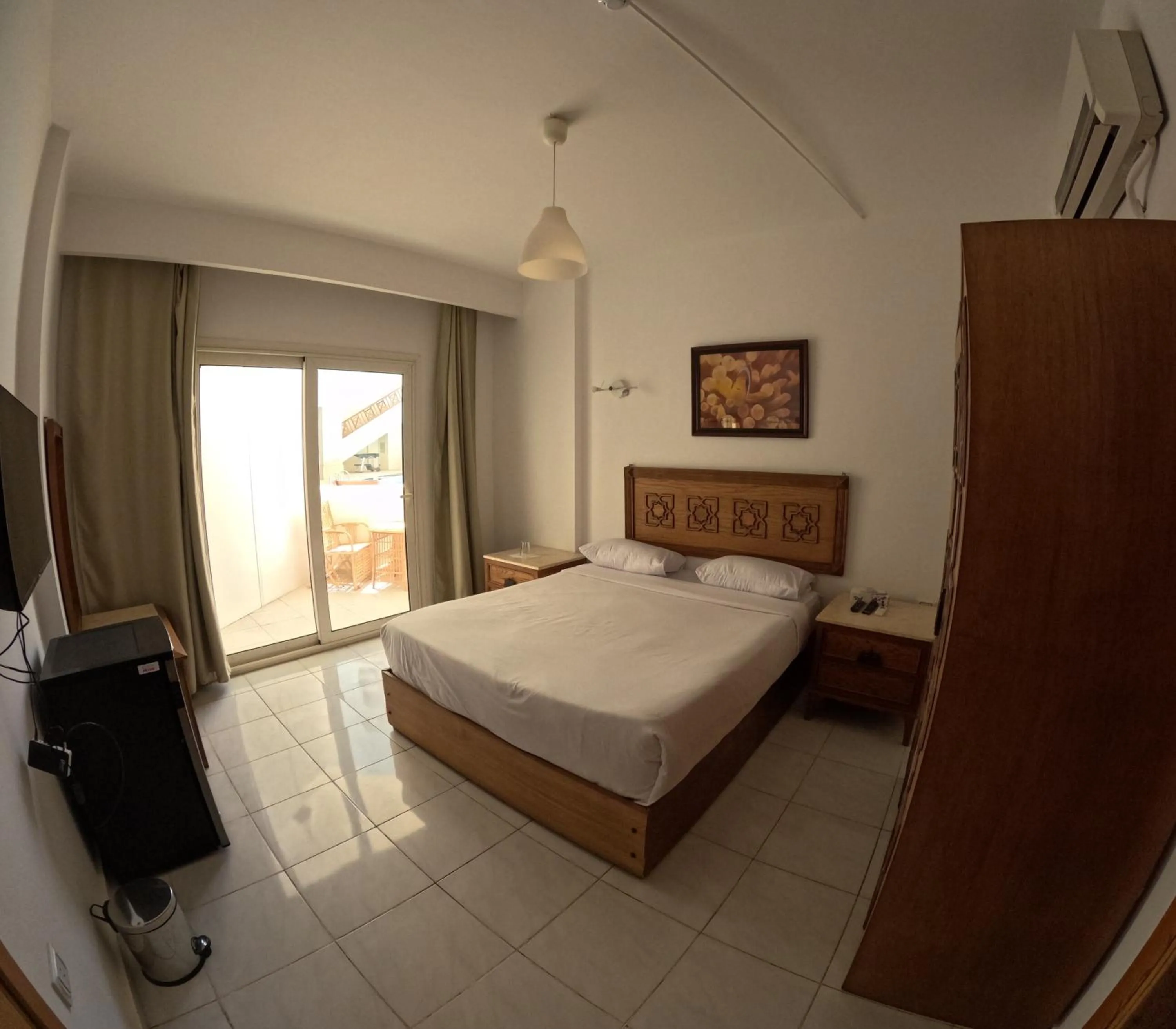 Bed in Blue Vision Diving Hotel