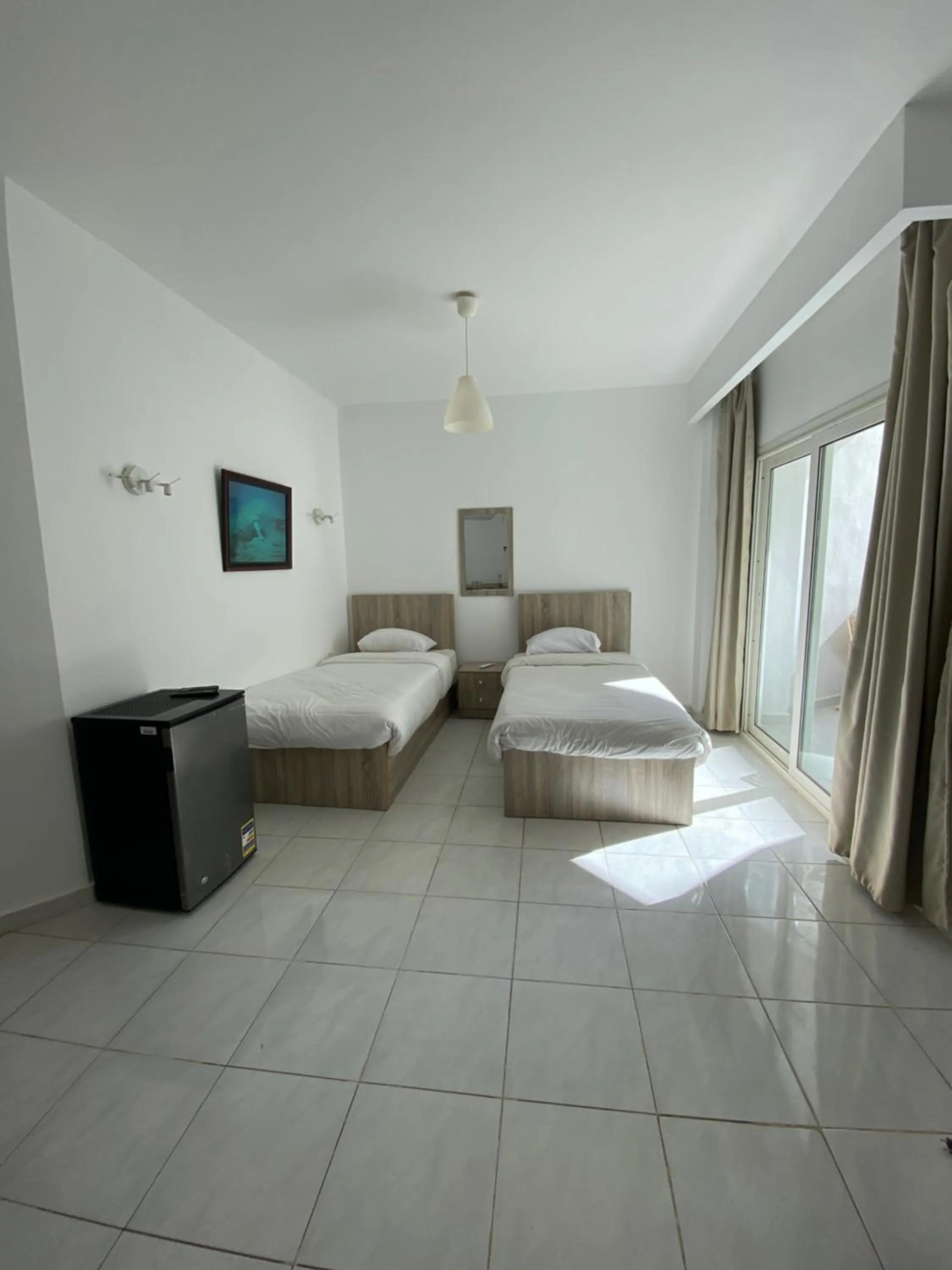 Bed in Blue Vision Diving Hotel