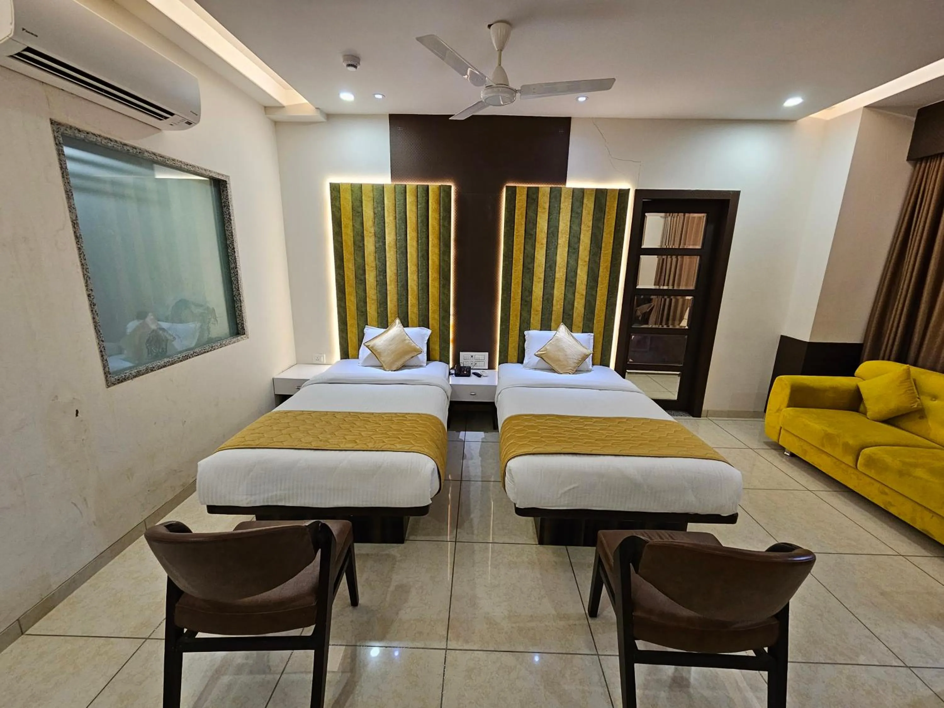 Bed in Hotel Grand Darshan Vadodara