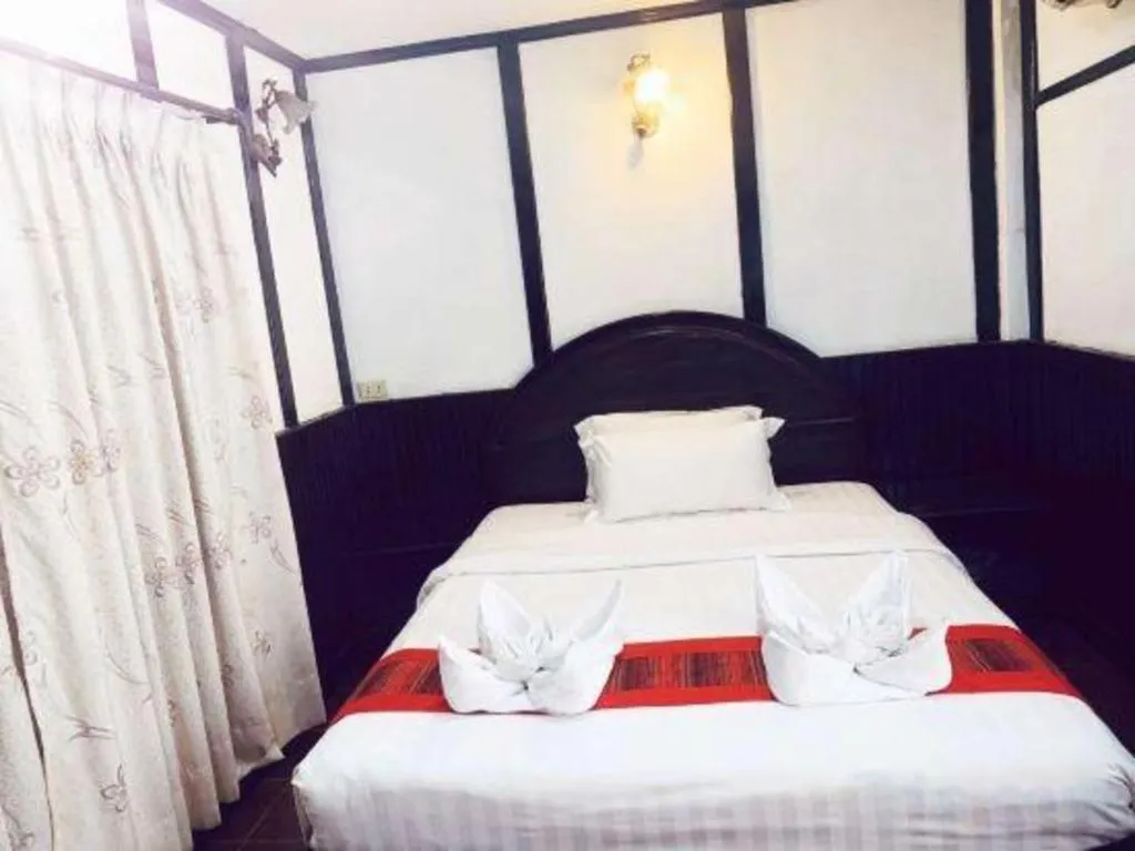 Bed in New Lao Paris Hotel