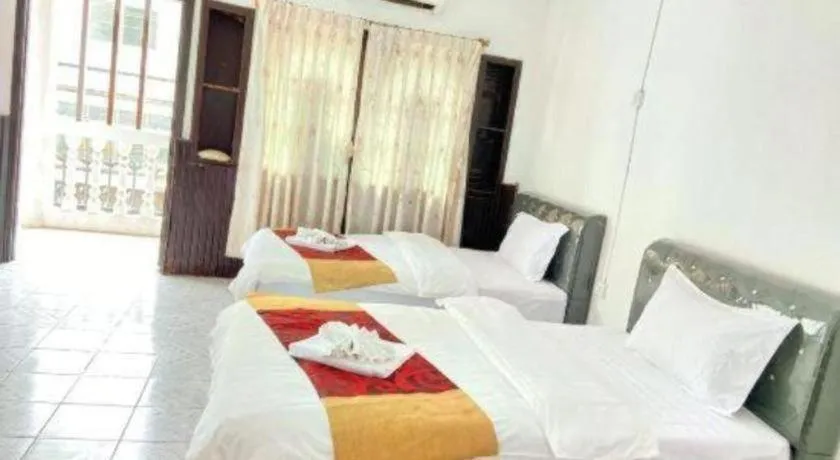 Bed in New Lao Paris Hotel