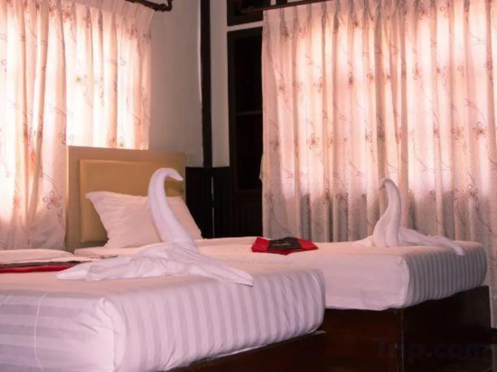 Bed in New Lao Paris Hotel