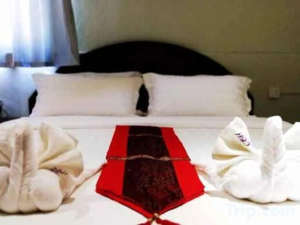 Bed in New Lao Paris Hotel