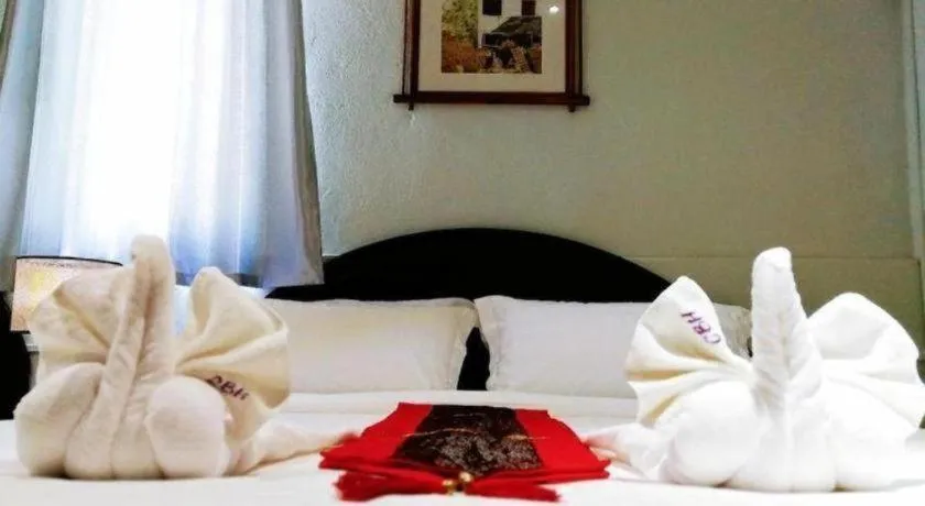 Bed in New Lao Paris Hotel