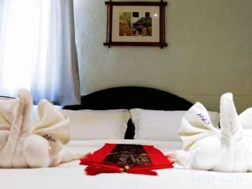 Bed in New Lao Paris Hotel