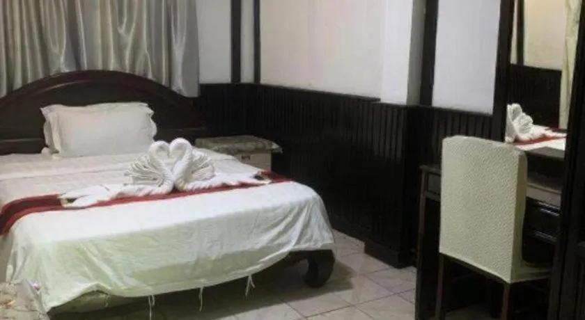 Bed in New Lao Paris Hotel