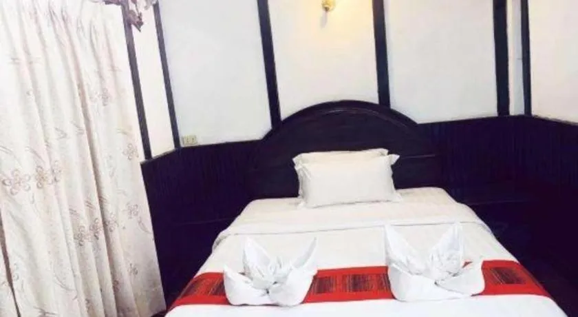Bed in New Lao Paris Hotel