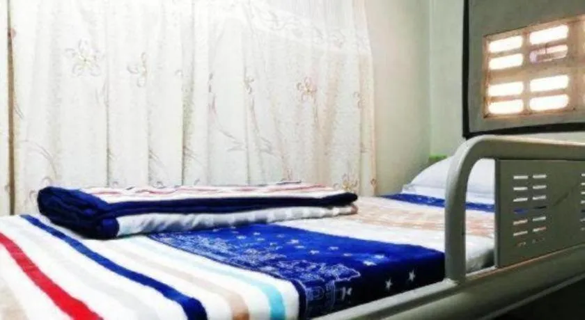 Bed in New Lao Paris Hotel