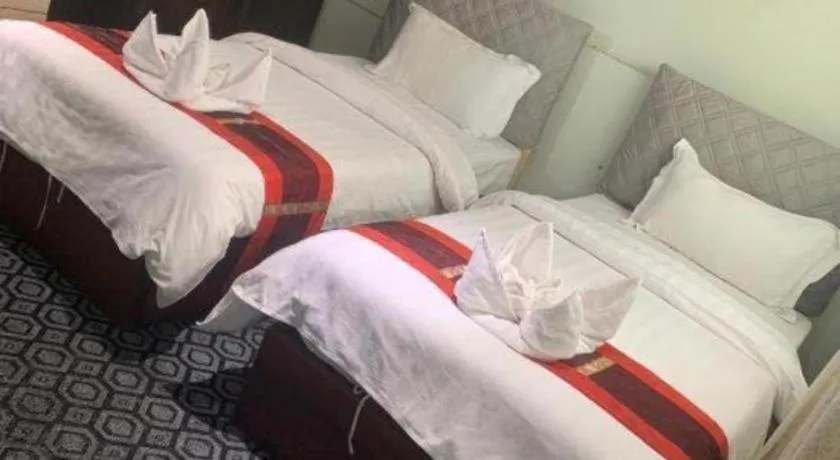 Bed in New Lao Paris Hotel