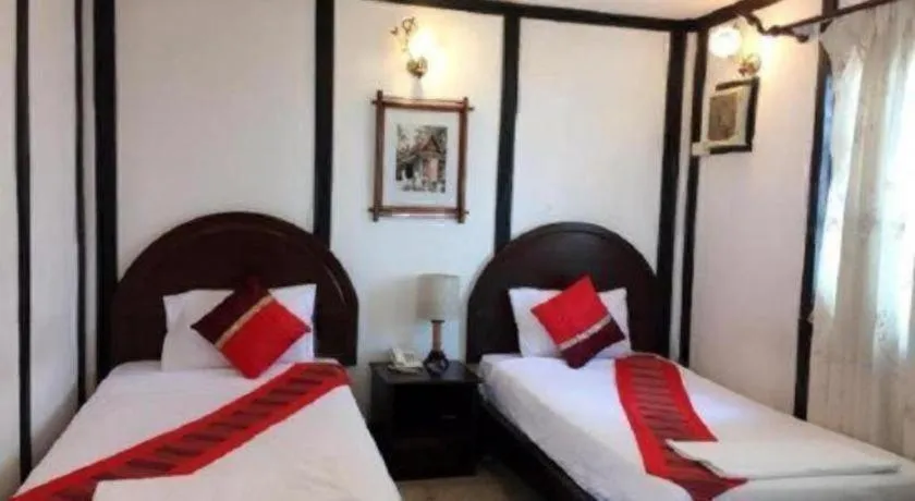 Bed in New Lao Paris Hotel