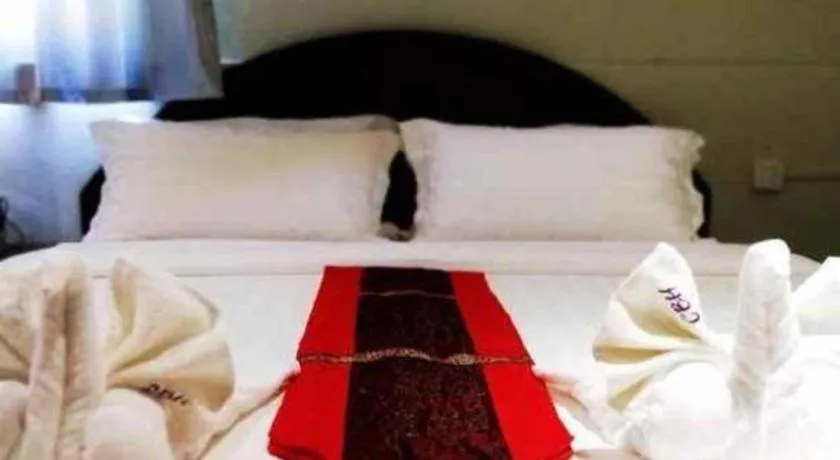 Bed in New Lao Paris Hotel