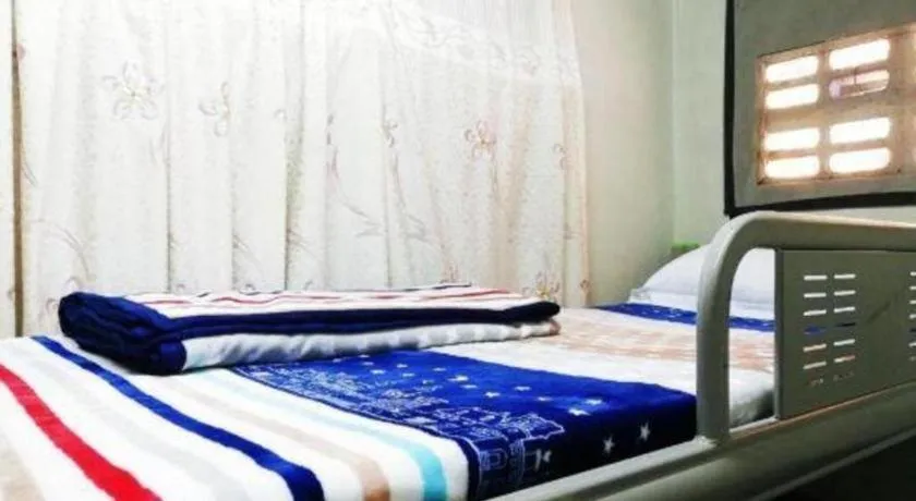 Bed in New Lao Paris Hotel