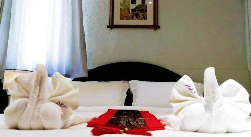 Bed in New Lao Paris Hotel