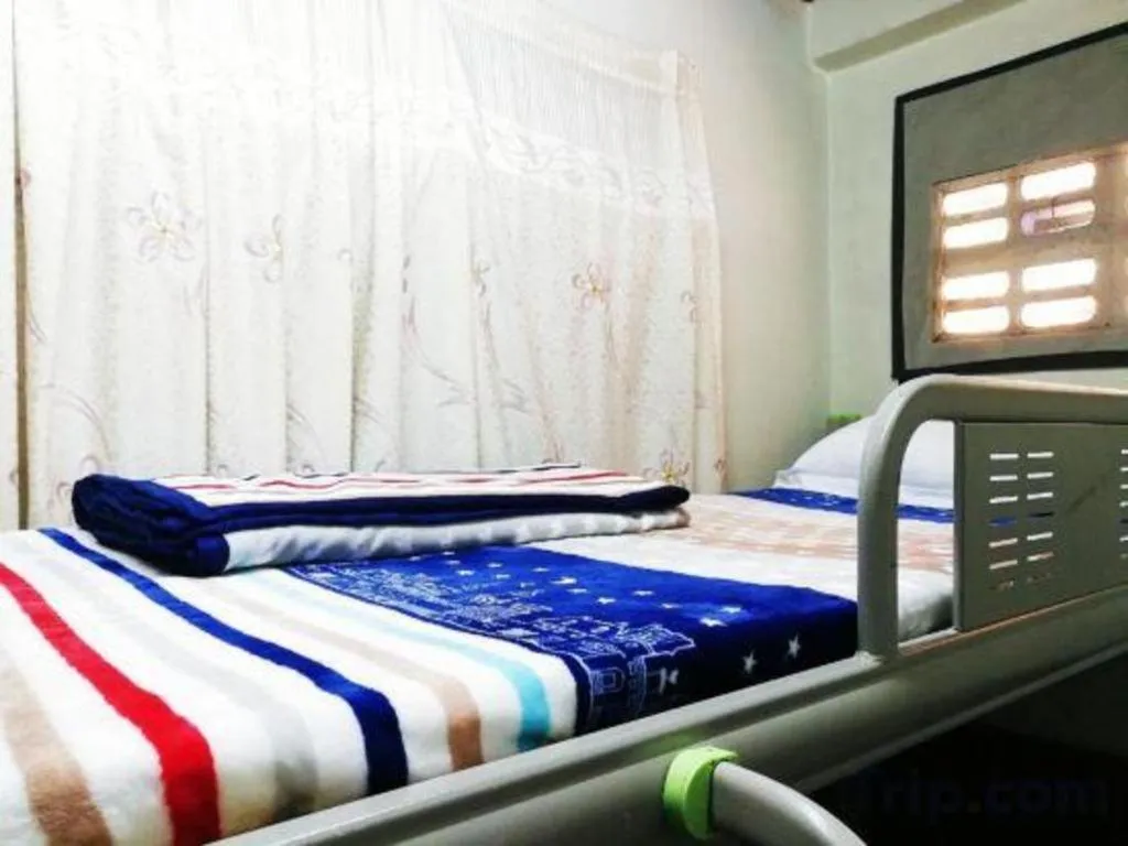 Bed in New Lao Paris Hotel