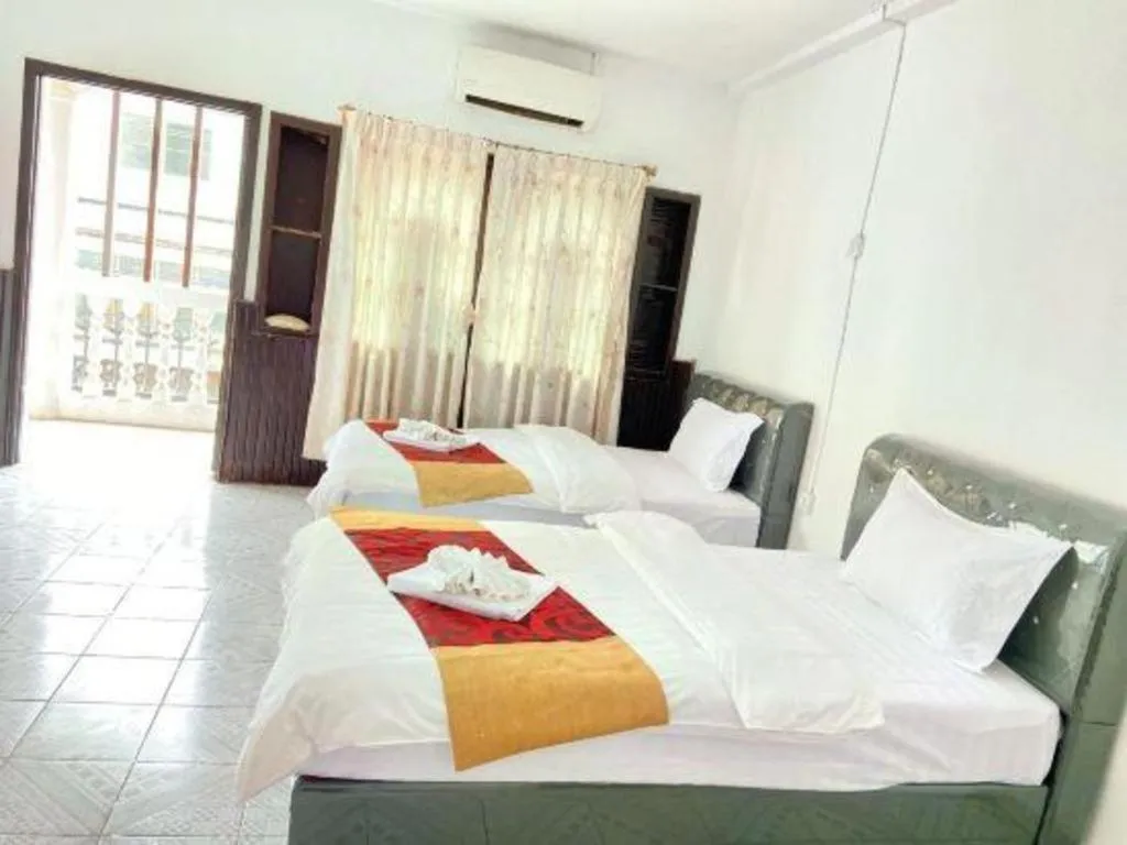 Bed in New Lao Paris Hotel