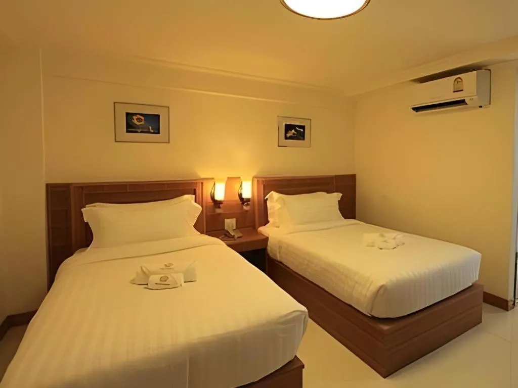Bed in Muanmanee Boutique Hotel
