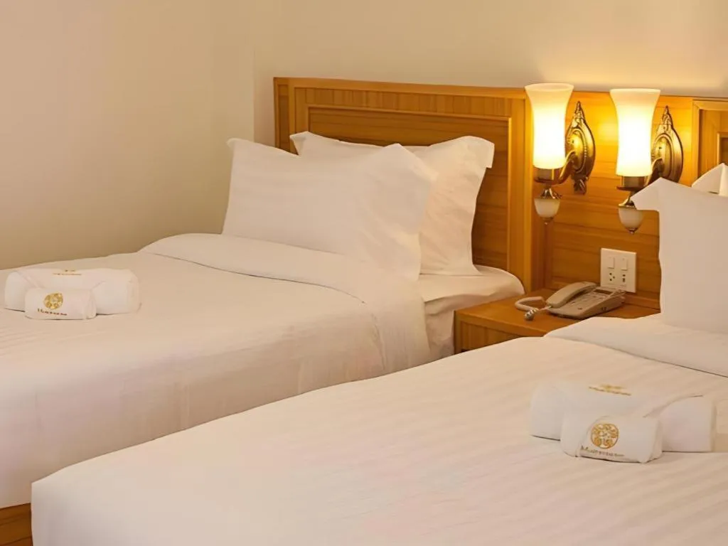 Bed in Muanmanee Boutique Hotel