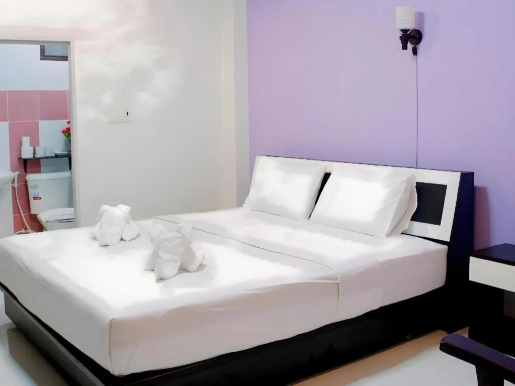 Bed in Nan Treasure Hotel