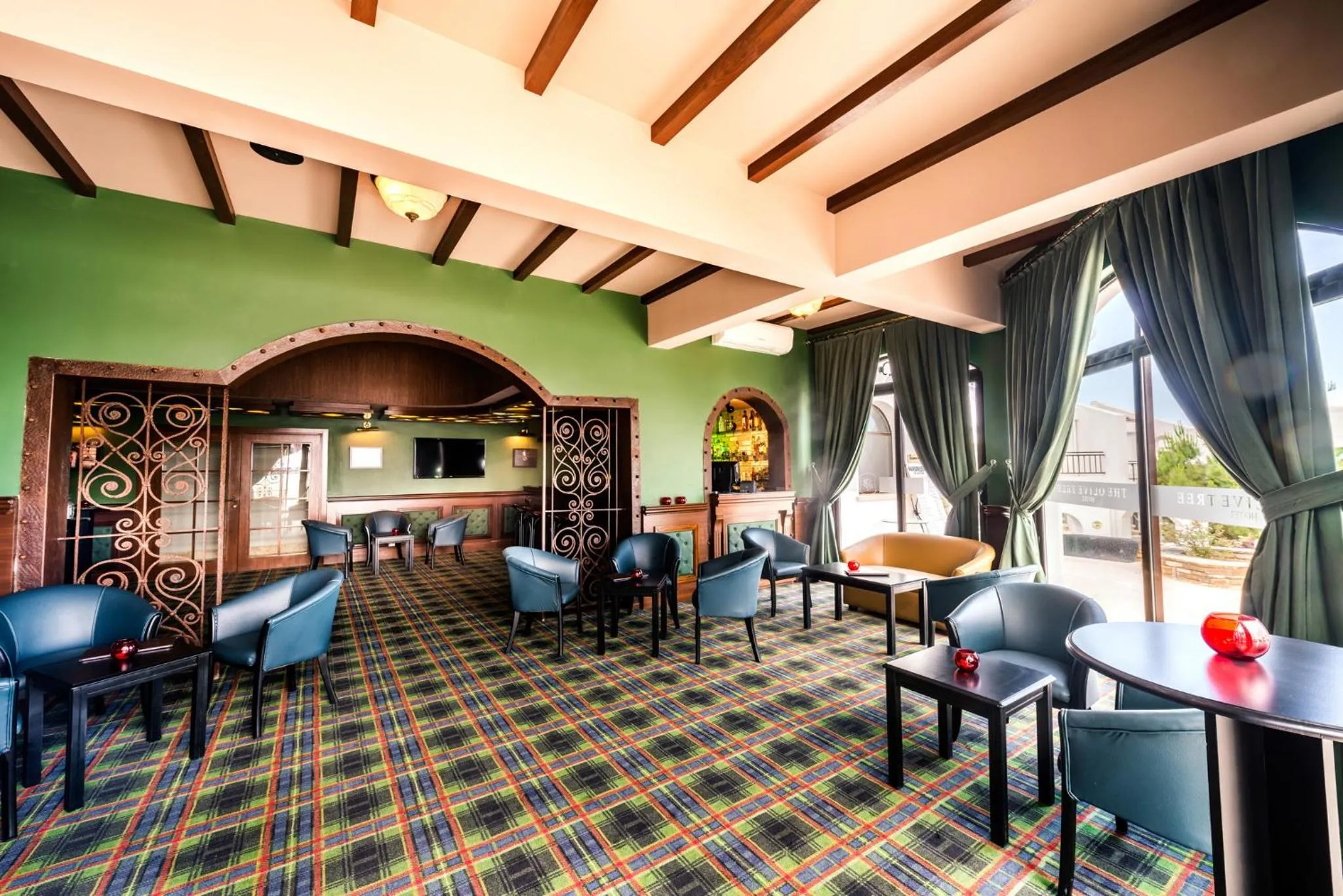 Communal lounge/ TV room in The Olive Tree Hotel