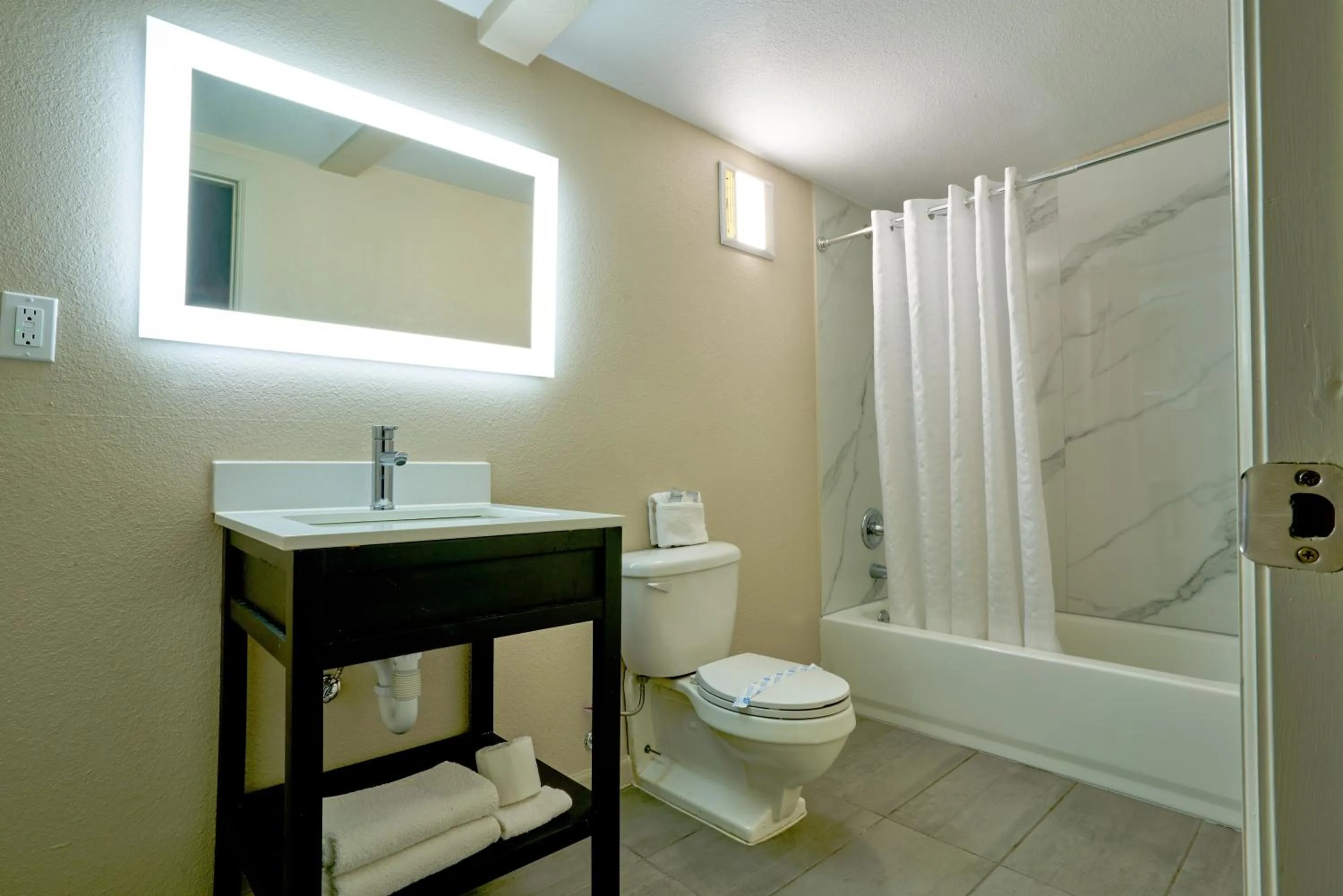 Bathroom in Family Garden Inn & Suites