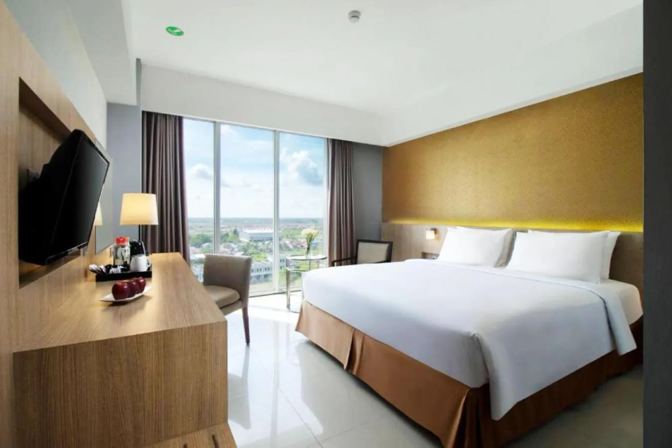 Photo of the whole room, Bed in Grand Tan Banjarmasin Hotel & Convention Center
