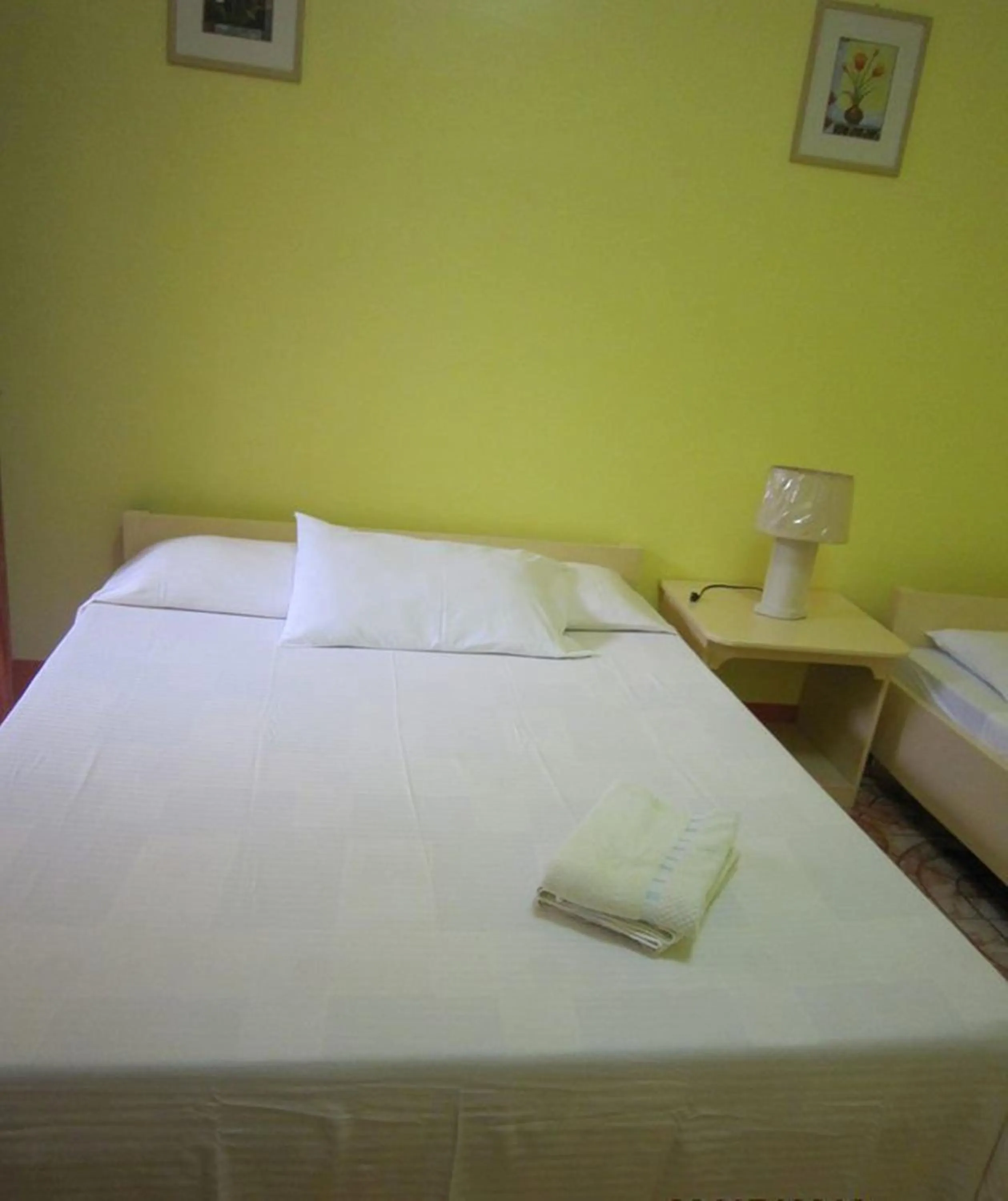 Bed in M&E Guesthouse