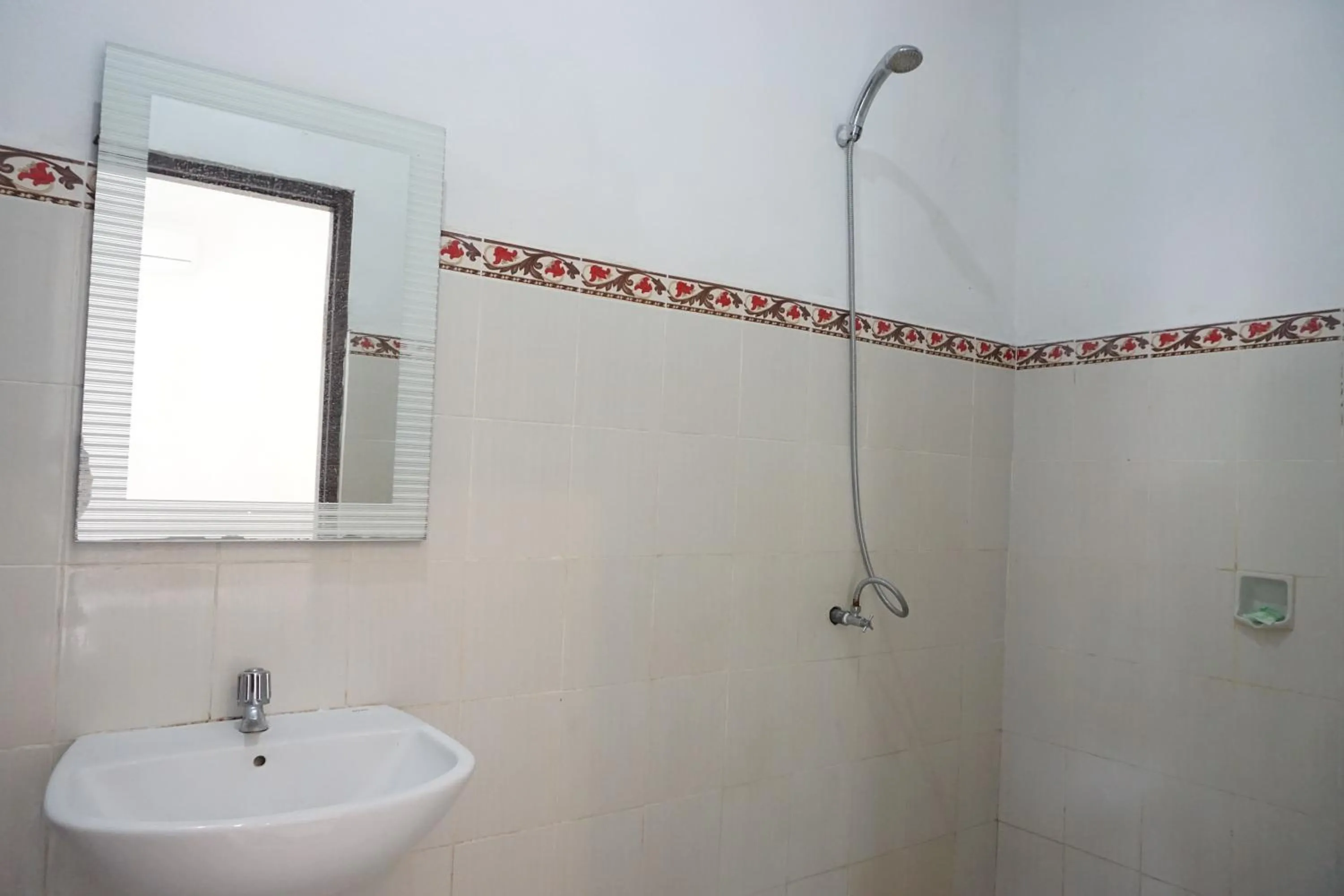 Bathroom in Nyoman Guesthouse and Grill