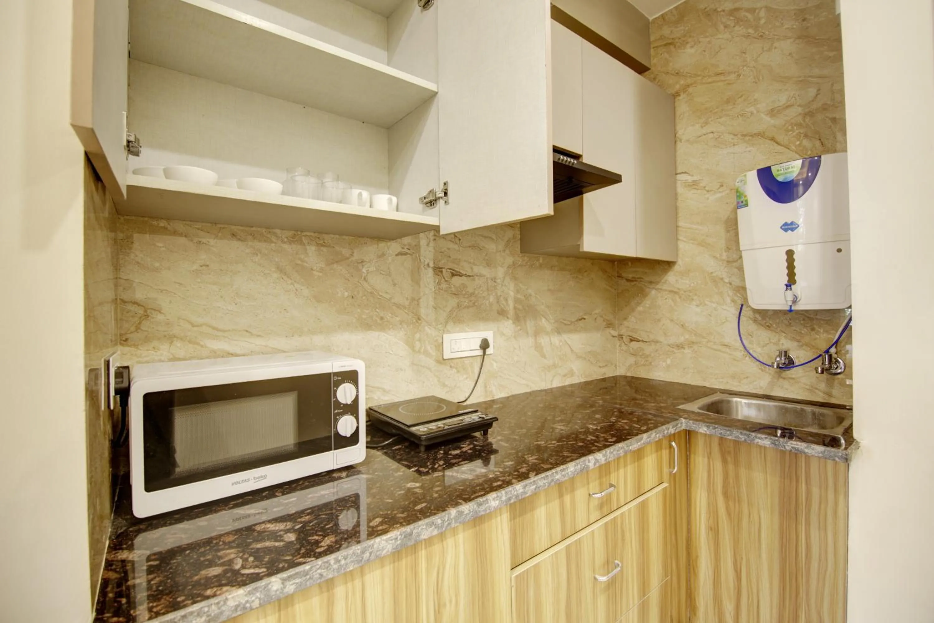 Kitchen or kitchenette in FlxHo Quad - Luxury Studio Apart Hotel DLF Cyber City