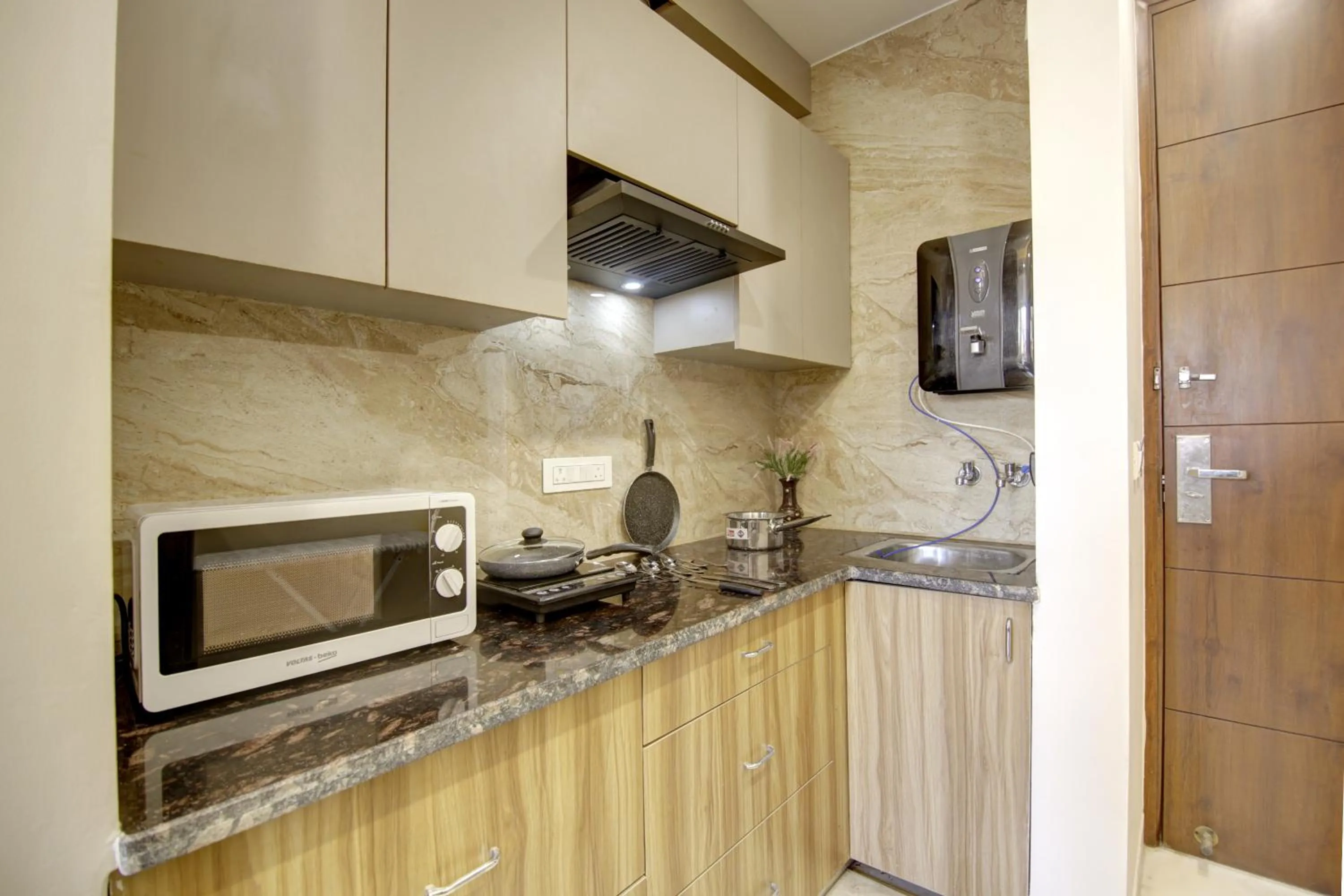 Kitchen or kitchenette in FlxHo Quad - Luxury Studio Apart Hotel DLF Cyber City
