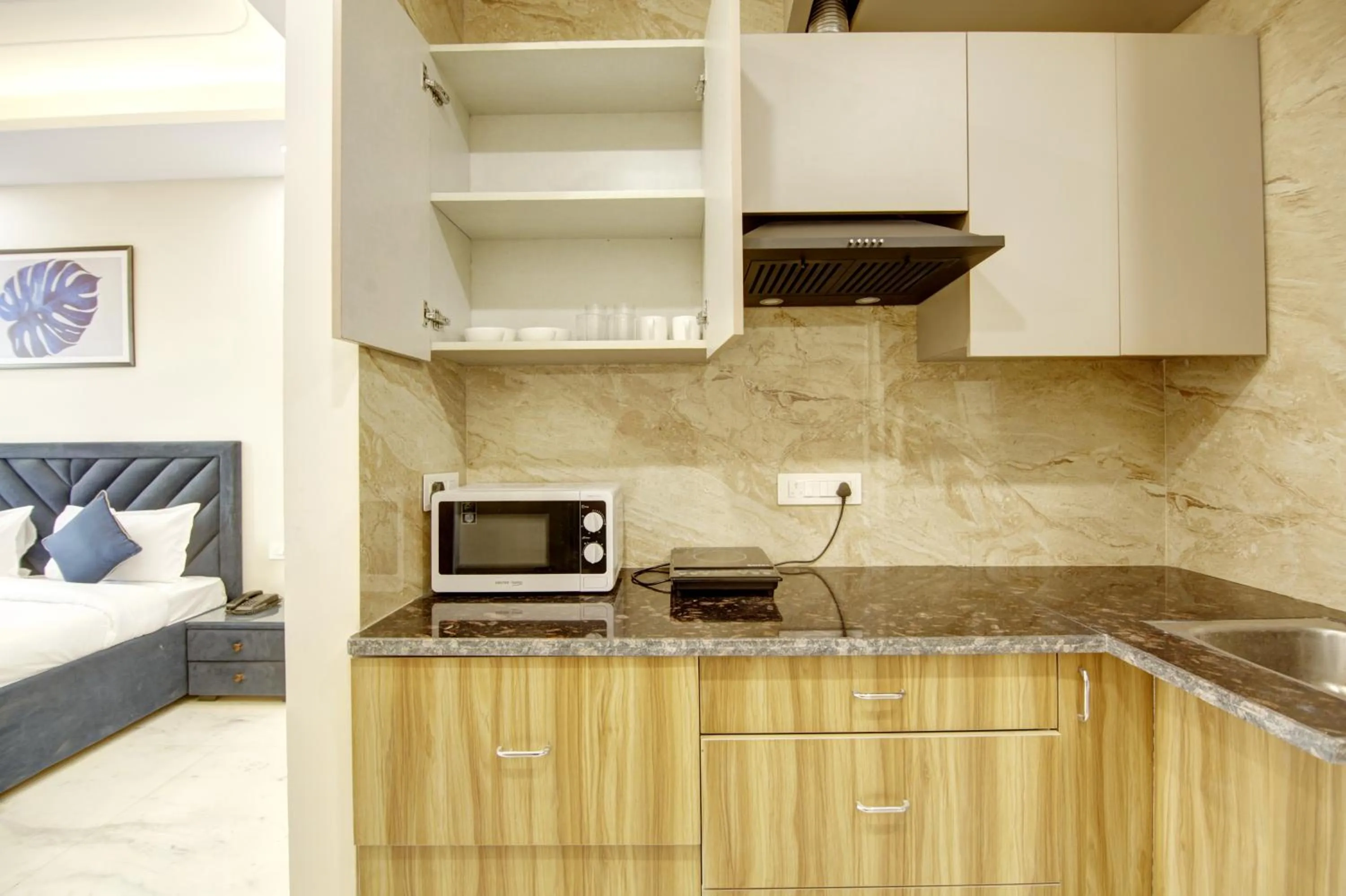 Kitchen or kitchenette in FlxHo Quad - Luxury Studio Apart Hotel DLF Cyber City