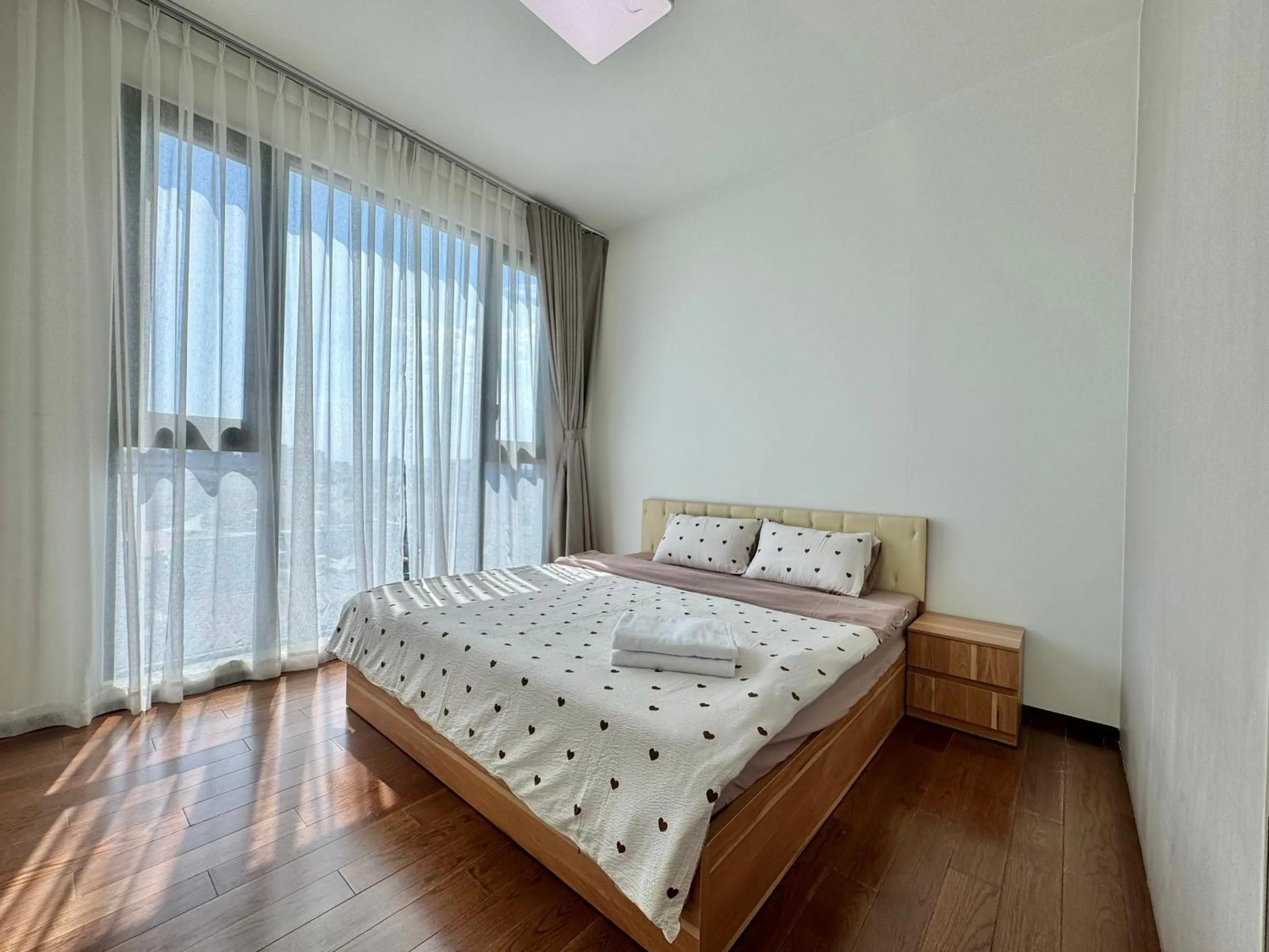Bed in Homie's Dedge Thao Dien Luxury Apartment