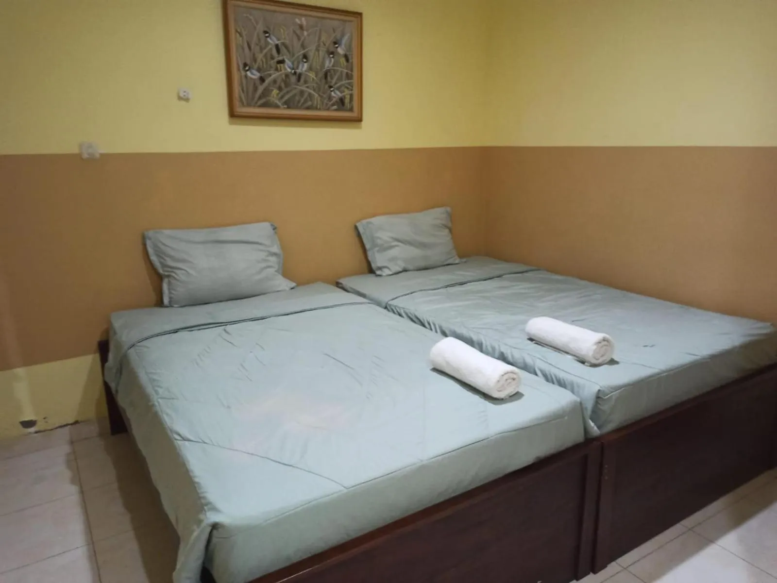 Bed in PROMOSIA GUEST HOUSE