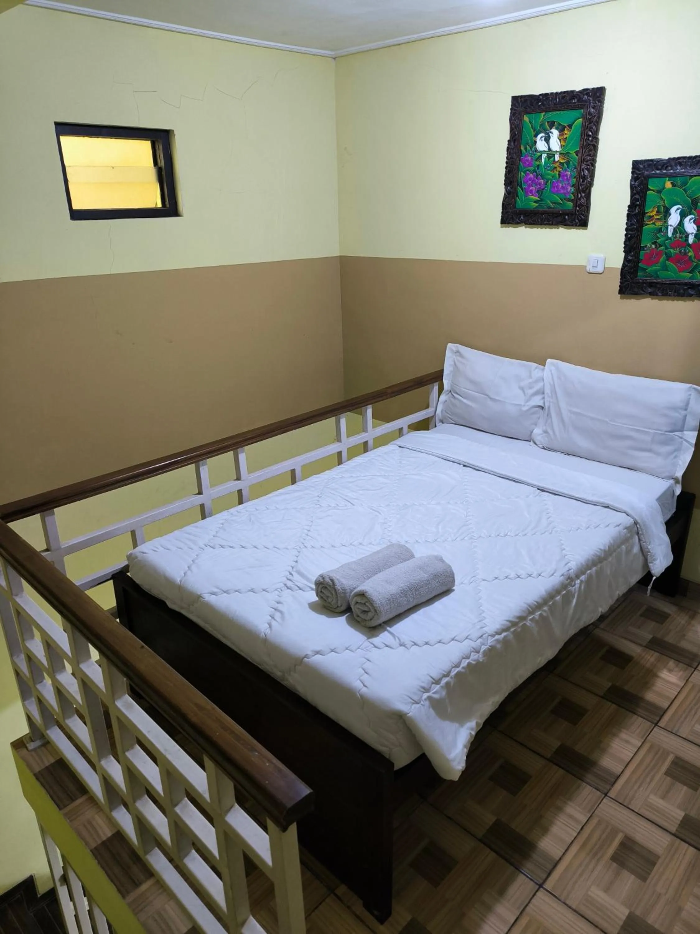 Bed in PROMOSIA GUEST HOUSE