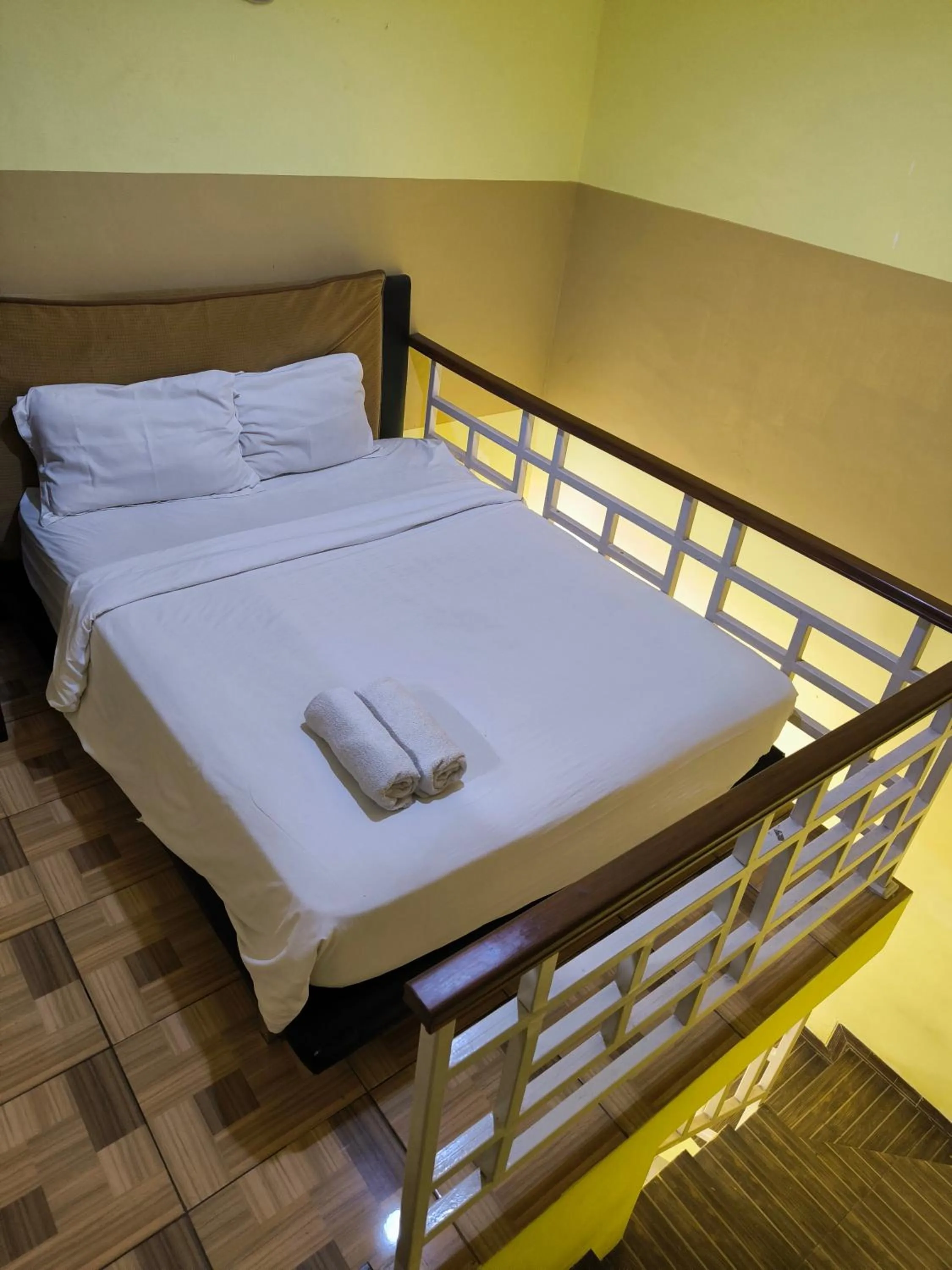 Bed in PROMOSIA GUEST HOUSE