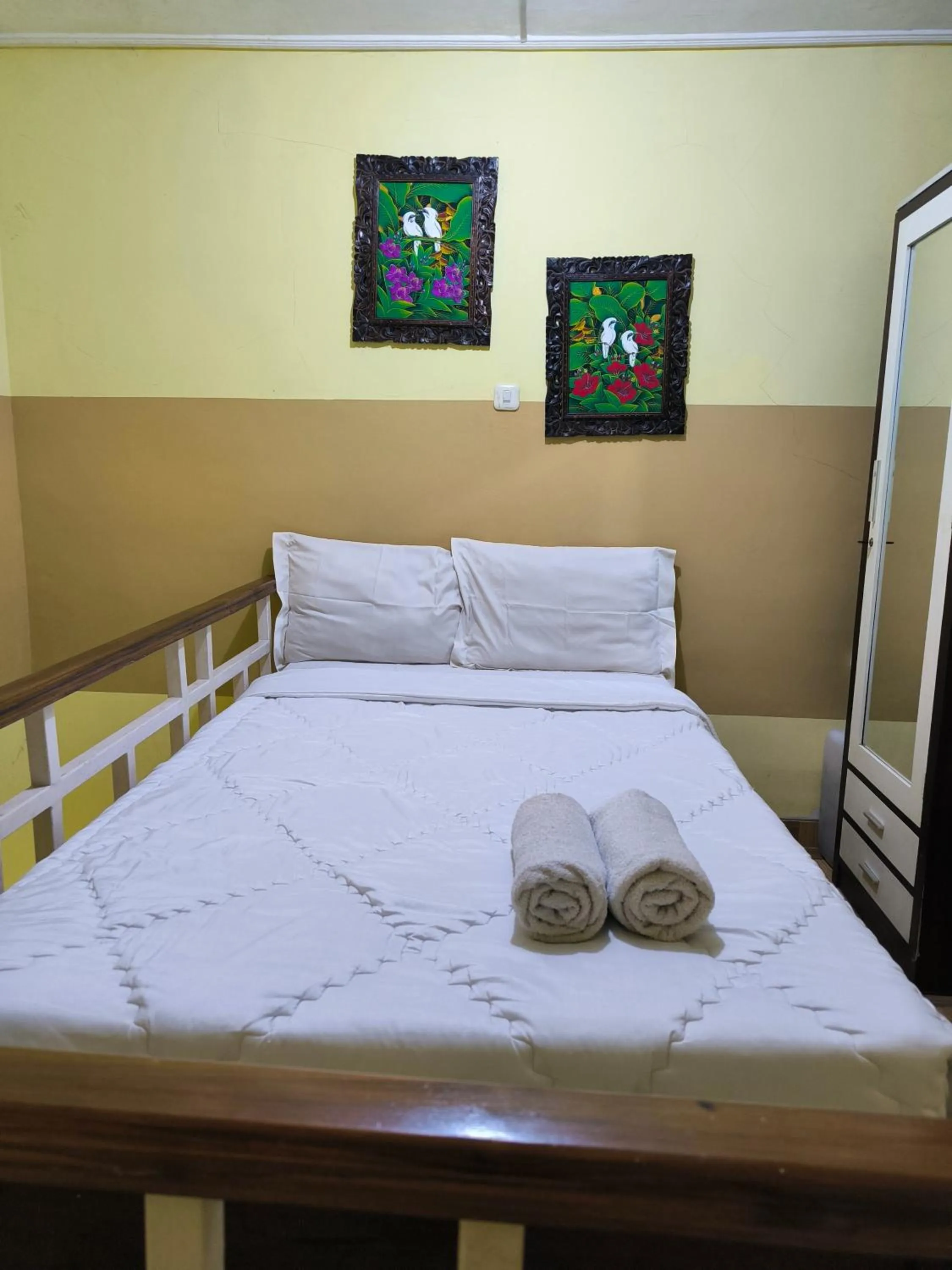 Bed in PROMOSIA GUEST HOUSE