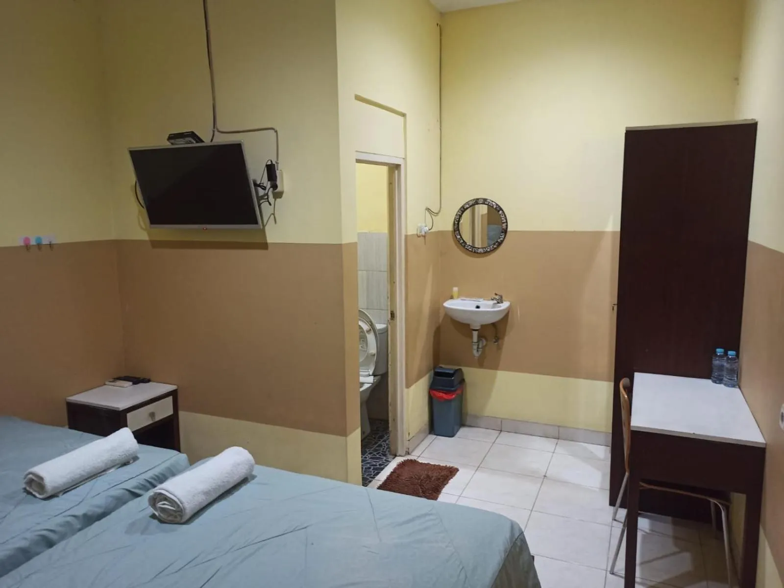 Bed in PROMOSIA GUEST HOUSE