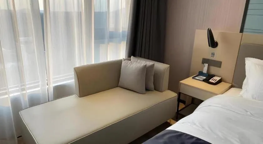 Bed in Echarm Hotel Changjiang Shilu