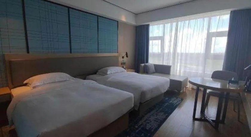 Bed in Echarm Hotel Changjiang Shilu
